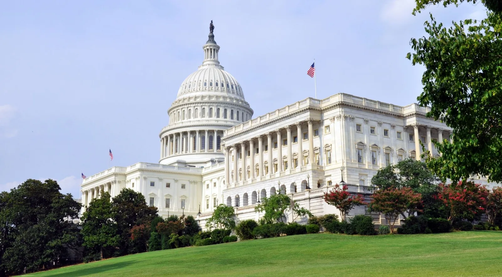 The U.S. Capitol west front above the lawn and flowerbeds
