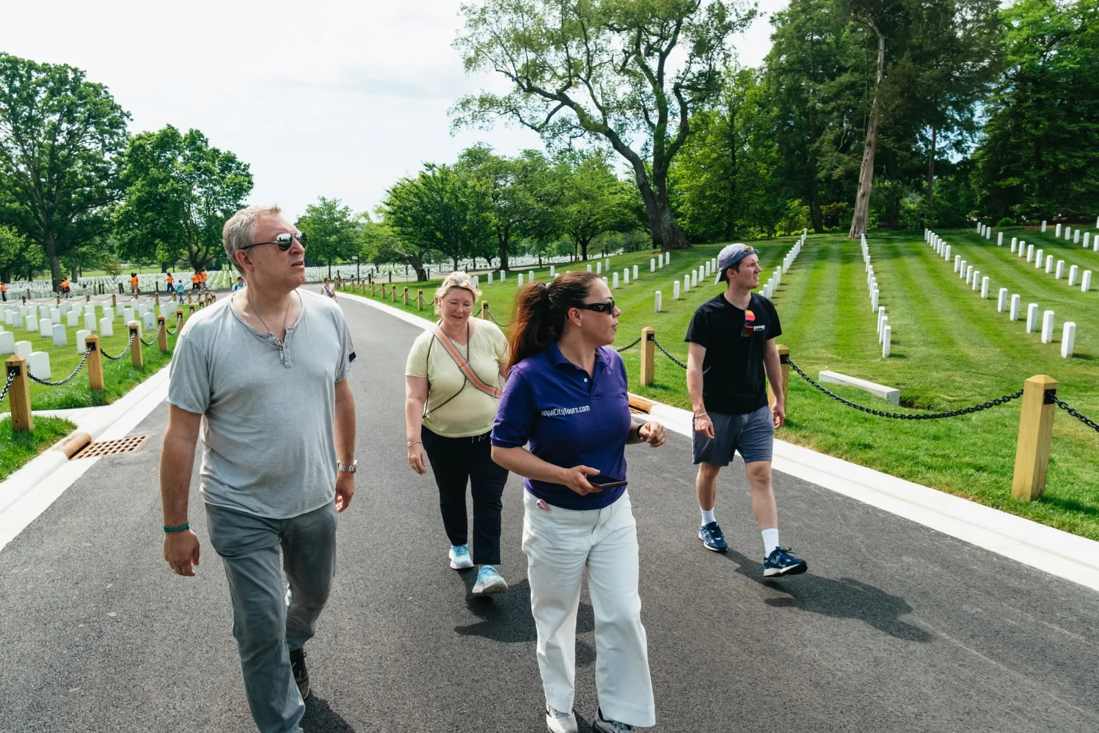 A guided group walking through Arlington National Cemetery